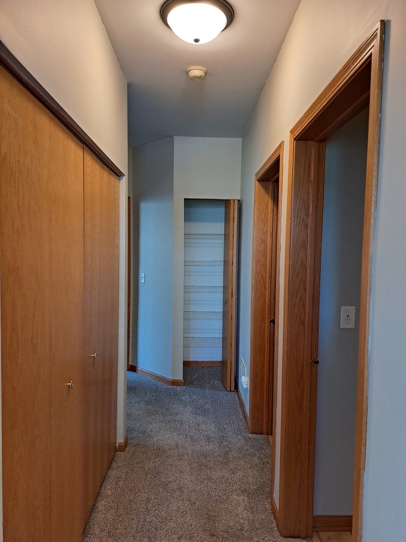 5111 Freeport Court Plainfield, IL 60586 - Photo 22 of 24 a view of a hallway with closet area