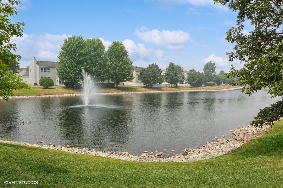 5111 Freeport Court Plainfield, IL 60586 - Photo 23 of 24 a view of a lake with a big yard