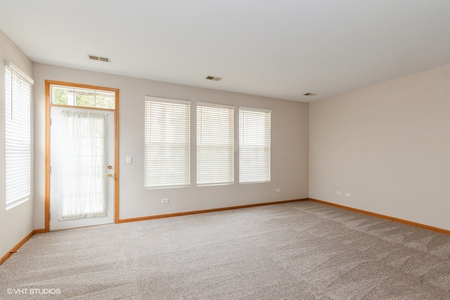 5111 Freeport Court Plainfield, IL 60586 - Photo 6 of 24 an empty room with a window
