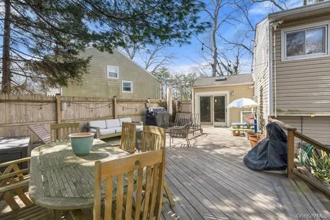 a view of a patio with couches chairs and a potted plant