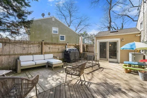 a view of a patio with couches chairs and potted plants
