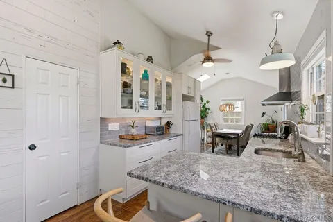 a view of living room and kitchen