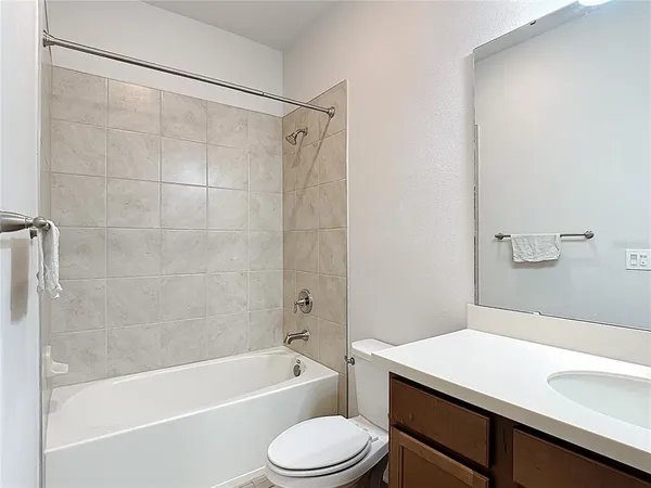 a bathroom with a sink a toilet and a bathtub