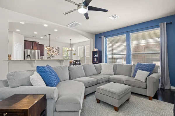 a living room with furniture and a large window