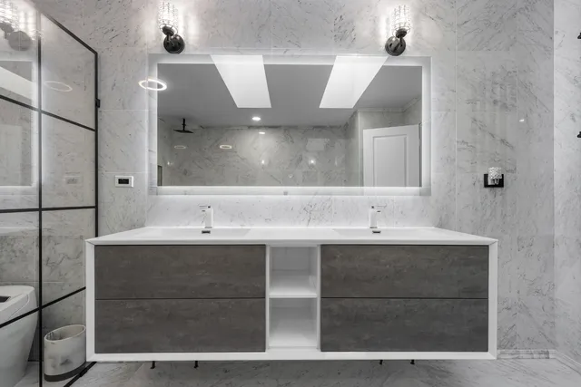 a bathroom with a sink and mirror