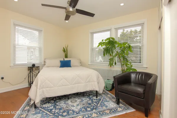 a bedroom with a large bed and a couch