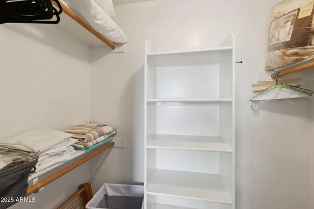 a room with a chair and a window