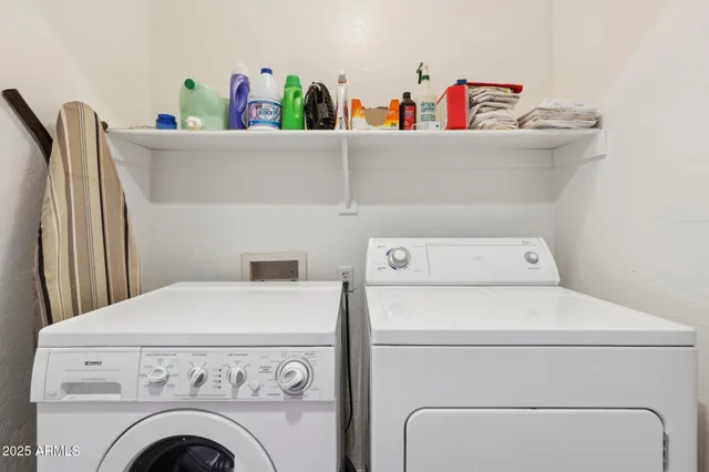 a bathroom with a sink vanity mirror and toilet