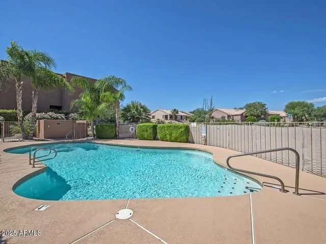 a kitchen with a dining table chairs and large window