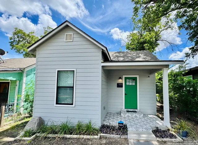 a front view of a house with a porch