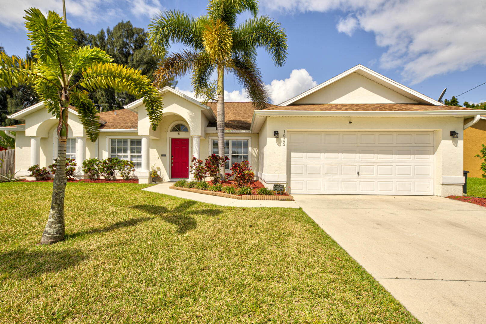 1029 Southwest Bay State Road Port St. Lucie, FL 34953 - Photo 1 of 39 a view of swimming pool with an outdoor space