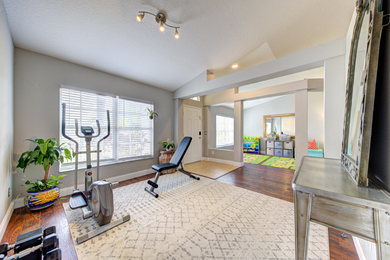 1029 Southwest Bay State Road Port St. Lucie, FL 34953 - Photo 11 of 39 a view of a livingroom with furniture and a flat screen tv
