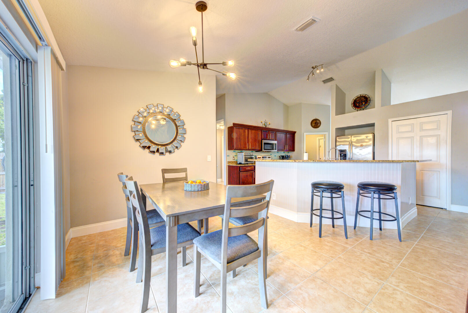 1029 Southwest Bay State Road Port St. Lucie, FL 34953 - Photo 19 of 39 a view of a dining area with furniture