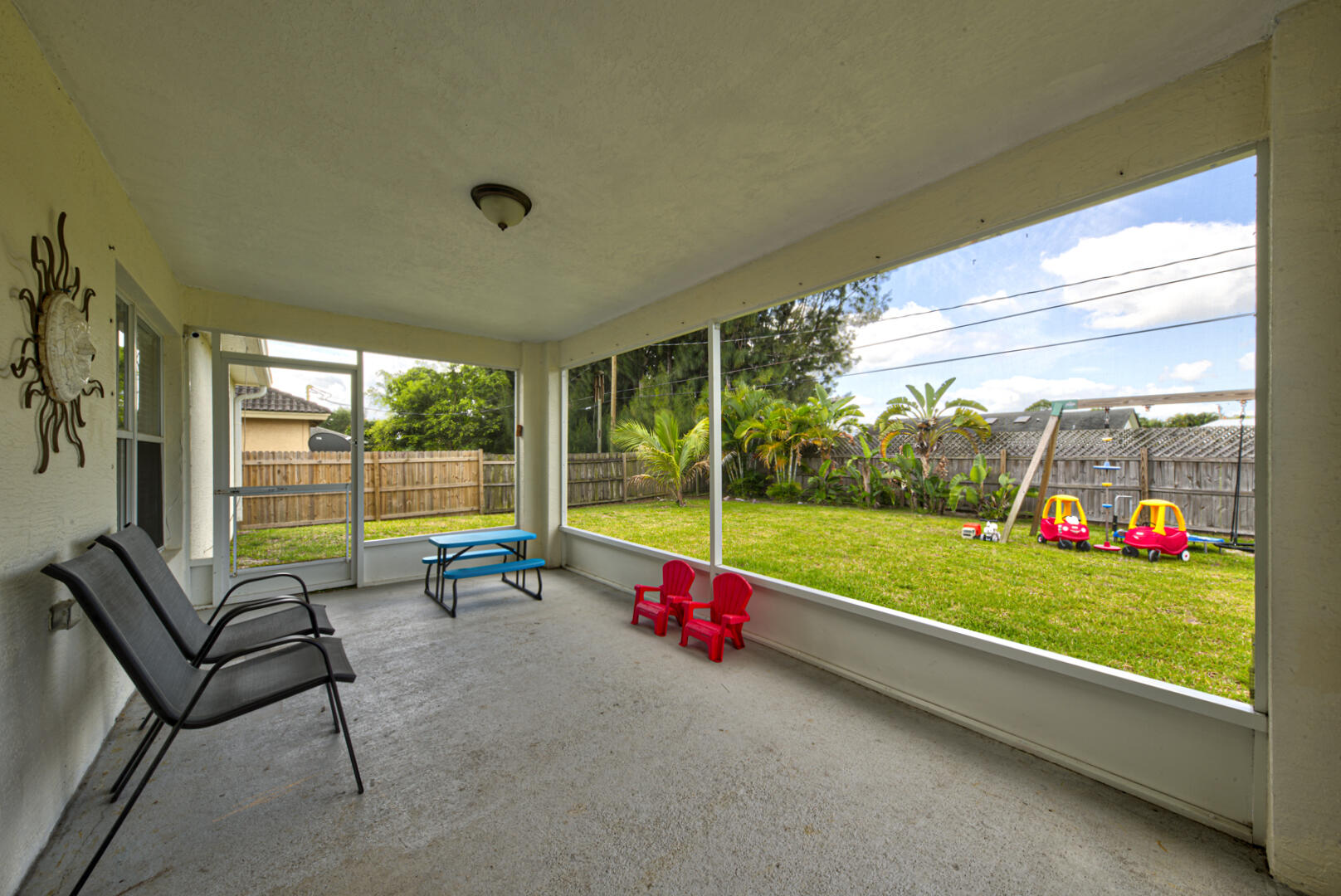 1029 Southwest Bay State Road Port St. Lucie, FL 34953 - Photo 35 of 39 a view of sitting area and yard