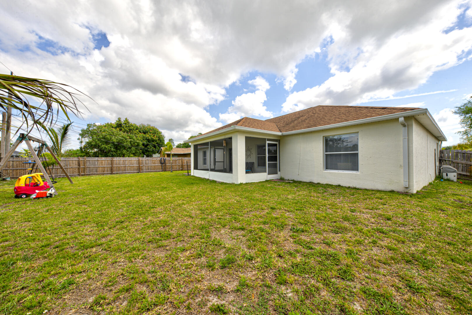 1029 Southwest Bay State Road Port St. Lucie, FL 34953 - Photo 39 of 39 a view of a house with backyard and garden