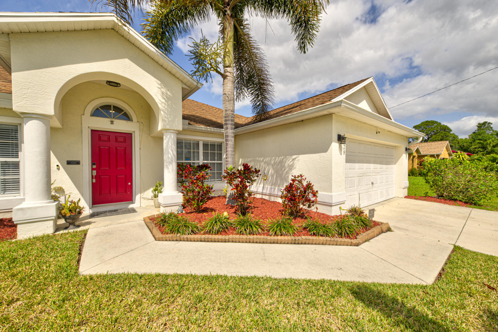 1029 Southwest Bay State Road Port St. Lucie, FL 34953 - Photo 4 of 39 a front view of house with yard