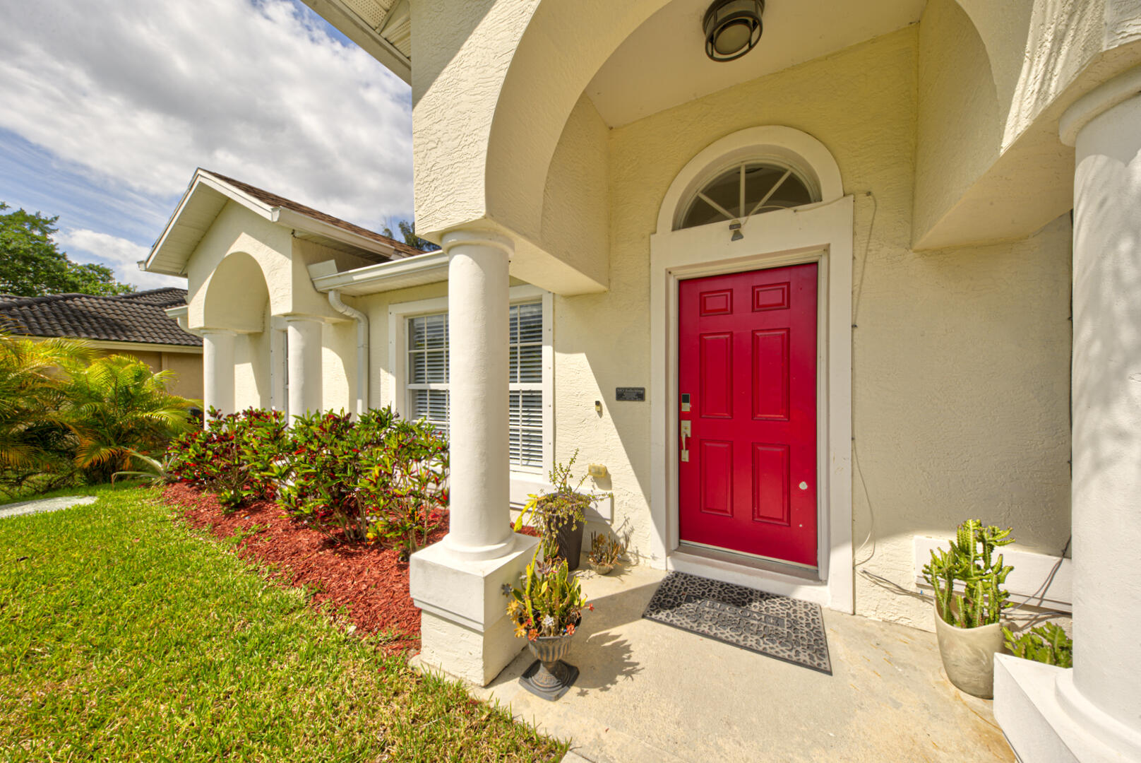 1029 Southwest Bay State Road Port St. Lucie, FL 34953 - Photo 5 of 39 a front view of a house with a yard