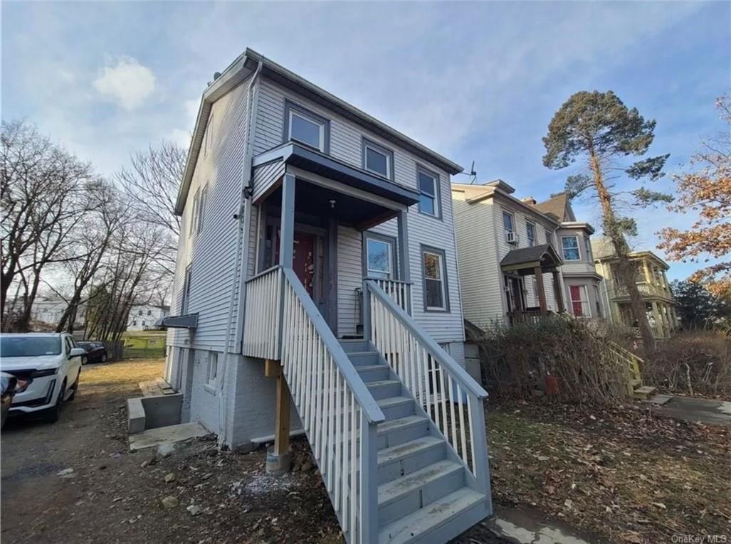 29 Hooker Avenue, Unit 2 Poughkeepsie, NY 12601 - Photo 9 of 9 a view of a house with a yard