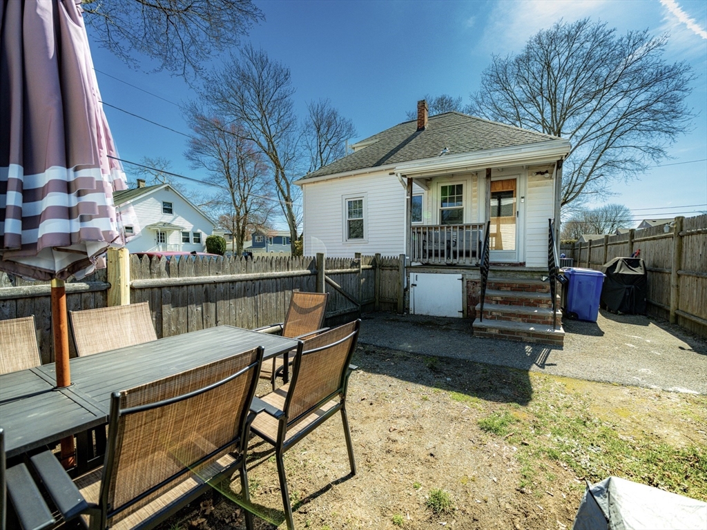10 Guild Road Saugus, MA 01906 - Photo 32 of 32 a view of a house with backyard porch and sitting area