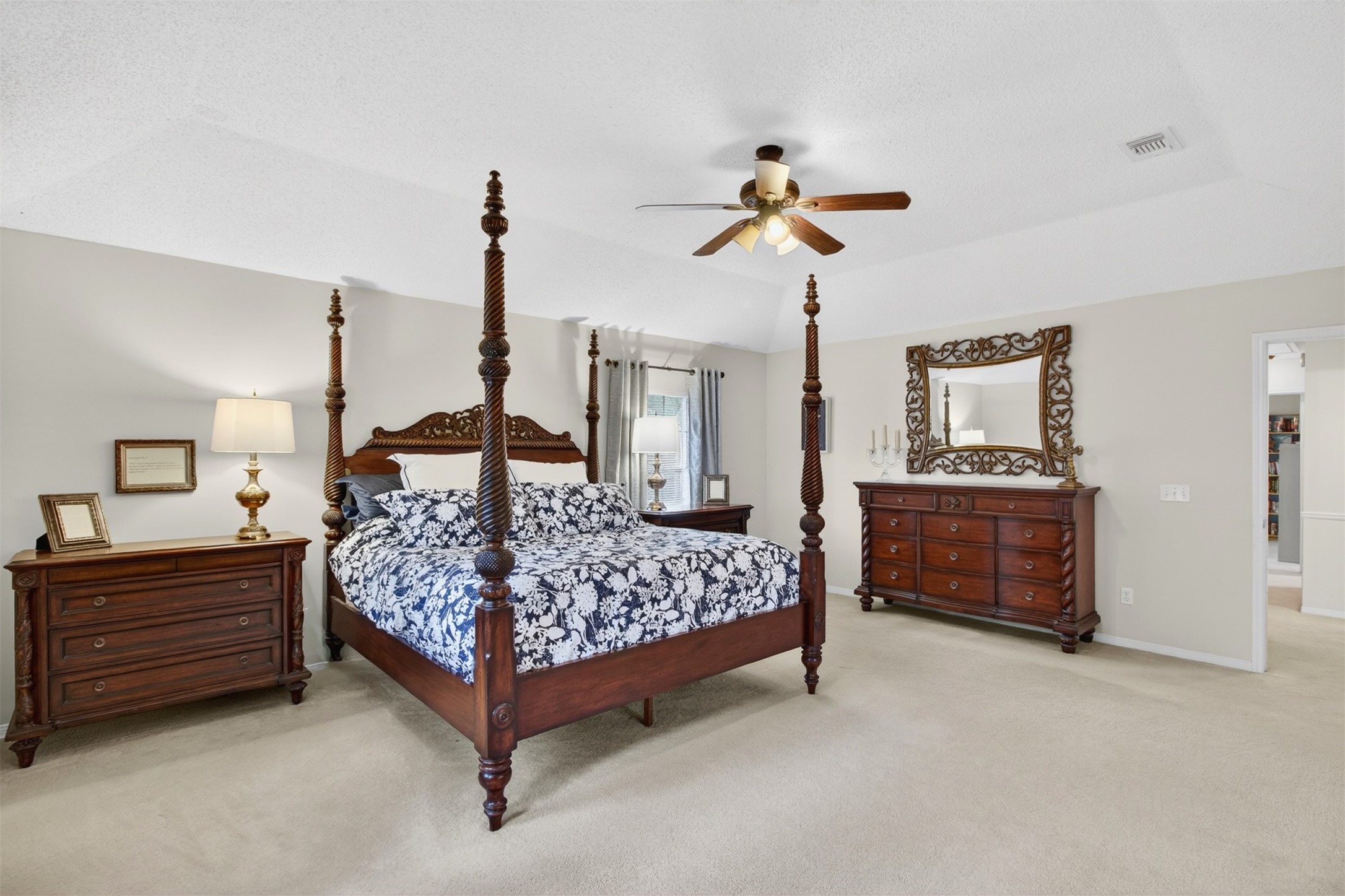 20214 Woodsboro Court Spring, TX 77388 - Photo 30 of 50 HUGE Primary Dream Suite! Plenty of room for your largest furniture! Gambrel Ceiling w/Recently updated Ceiling Fan! Door leads to Hallway and 3 more Bedrooms!