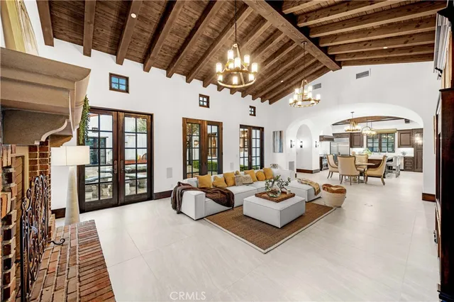 a dining room with furniture and a chandelier