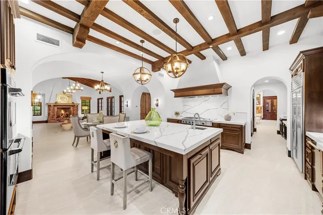 a spacious bedroom with a bed and a large window