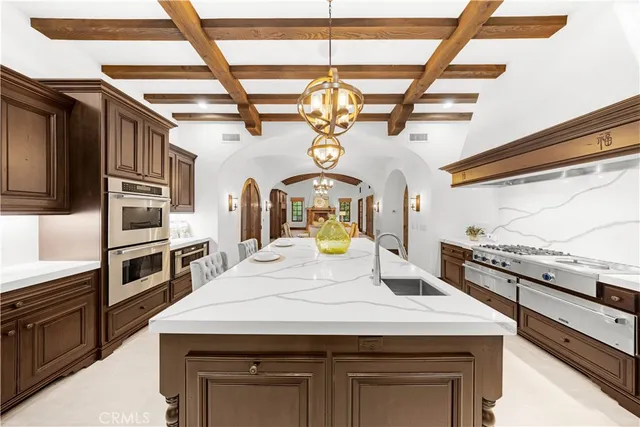 a spacious bedroom with a bed and a couch