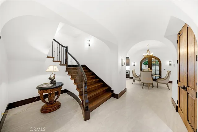 a spacious bathroom with a granite countertop sink and a large mirror