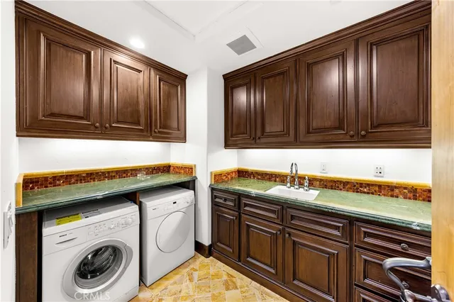 a bathroom with a granite countertop toilet a sink and a mirror