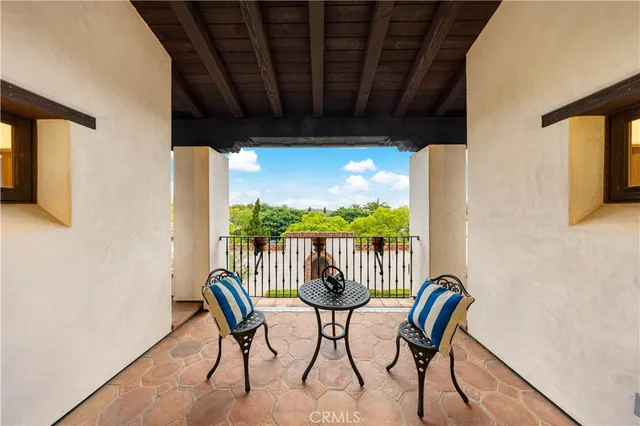 a bedroom with a bed and a ceiling fan