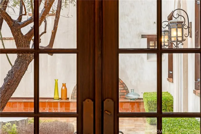 a view of swimming pool with outdoor seating and house in the background