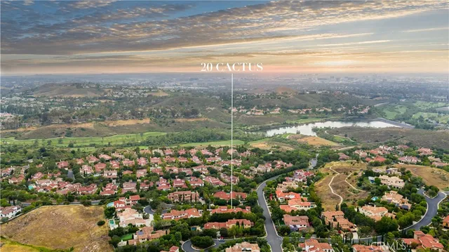 a living room with furniture a fireplace and chandelier
