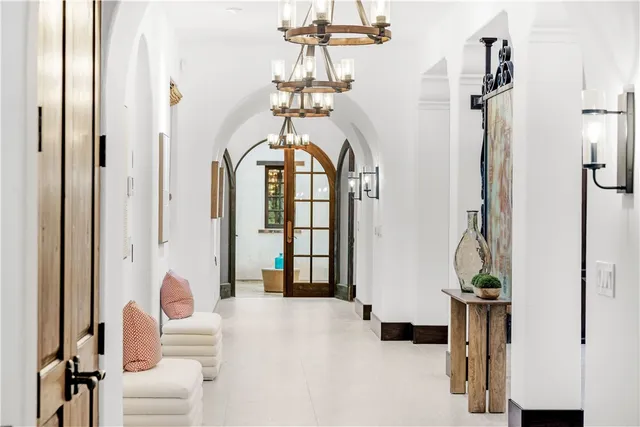 a bathroom with a granite countertop toilet a sink and a mirror