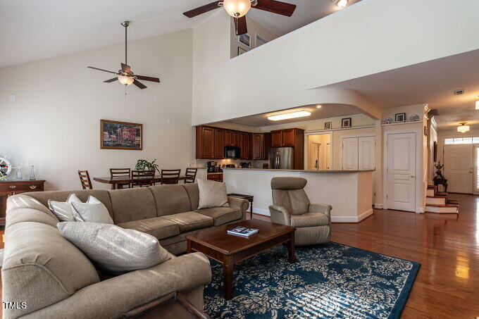 3742 Old Post Road Raleigh, NC 27612 - Photo 12 of 35 a living room with furniture a rug and a lamp