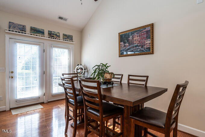 3742 Old Post Road Raleigh, NC 27612 - Photo 13 of 35 a view of a dining room with furniture window and wooden floor