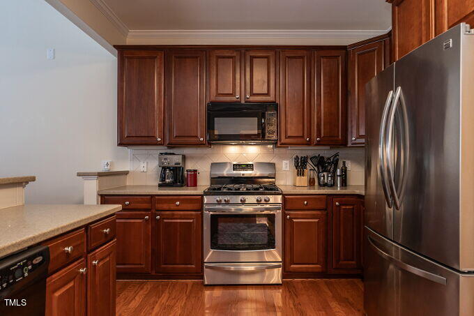 3742 Old Post Road Raleigh, NC 27612 - Photo 15 of 35 a kitchen with a stove and a refrigerator