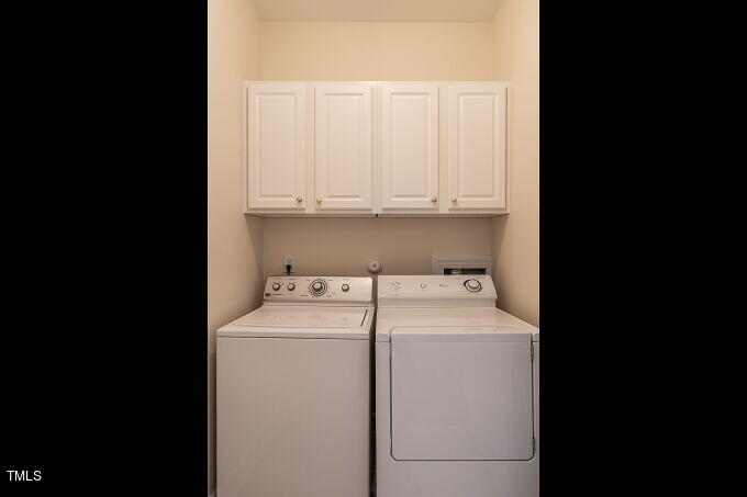 3742 Old Post Road Raleigh, NC 27612 - Photo 18 of 35 a view of storage and utility room with washer and dryer