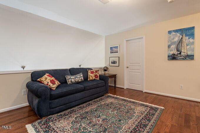 3742 Old Post Road Raleigh, NC 27612 - Photo 21 of 35 a living room with furniture and wooden floor