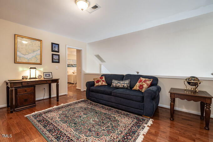 3742 Old Post Road Raleigh, NC 27612 - Photo 22 of 35 a living room with furniture and a rug