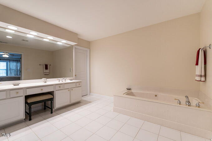 3742 Old Post Road Raleigh, NC 27612 - Photo 25 of 35 a bathroom with a sink and a bathtub