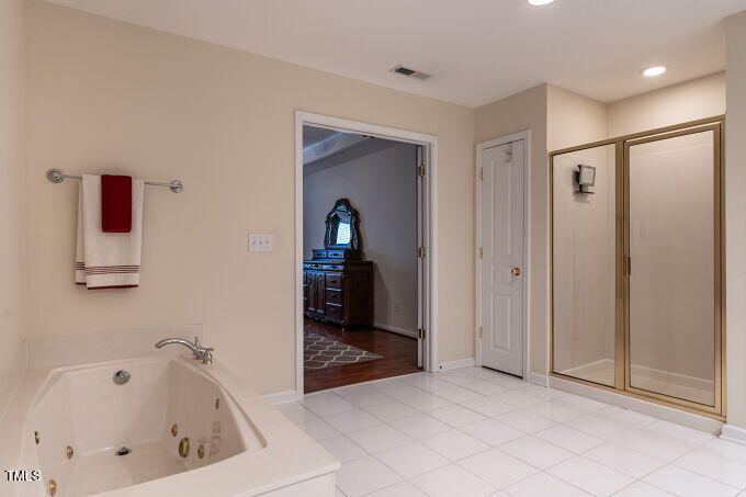 3742 Old Post Road Raleigh, NC 27612 - Photo 26 of 35 a bathroom with a bathtub and a shower