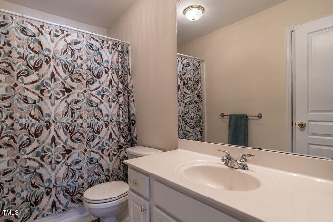 3742 Old Post Road Raleigh, NC 27612 - Photo 28 of 35 a bathroom with a sink toilet and shower