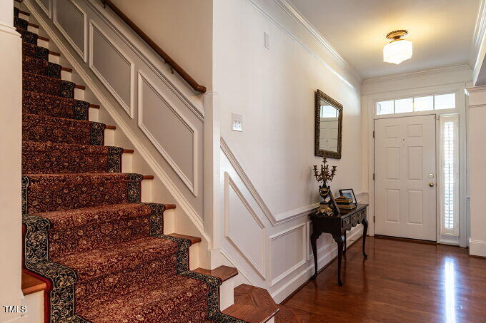 3742 Old Post Road Raleigh, NC 27612 - Photo 4 of 35 a view of entryway and hall with wooden floor