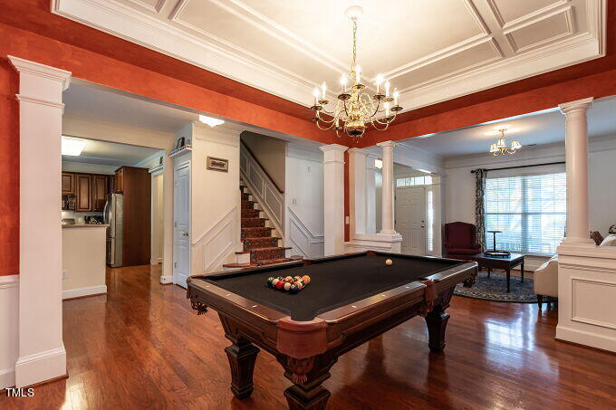 3742 Old Post Road Raleigh, NC 27612 - Photo 7 of 35 a living room with a table chairs and a chandelier