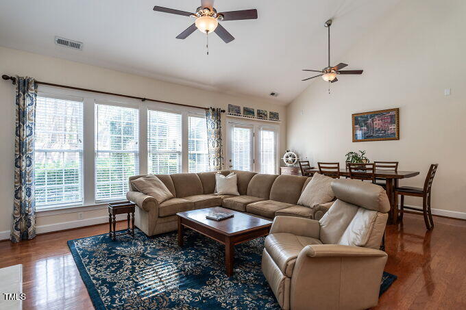 3742 Old Post Road Raleigh, NC 27612 - Photo 8 of 35 a living room with furniture a large window and a rug