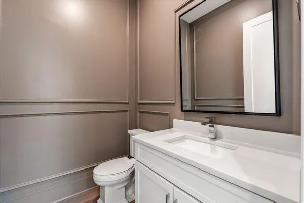 a bathroom with a toilet sink and shower