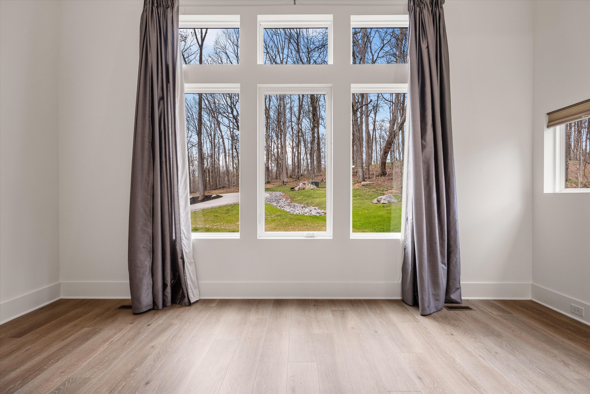 925 Weeping Willow Road, Unit D Hendersonville, TN 37075 - Photo 24 of 73 a view of an empty room with wooden floor and windows