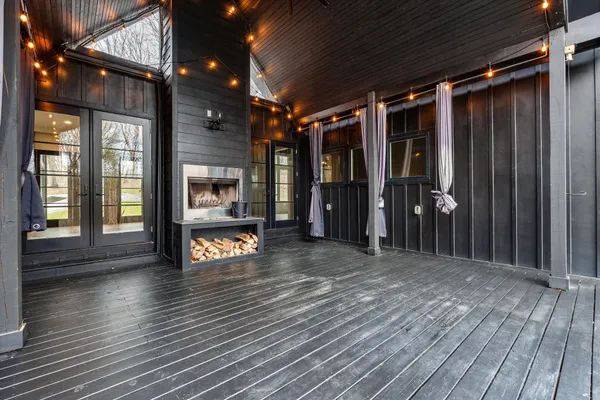 an entrance door of a house with wooden floor