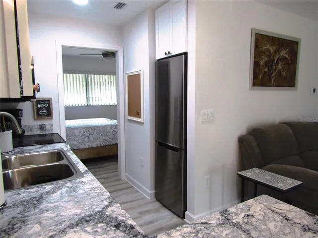 a bedroom with bed and furniture