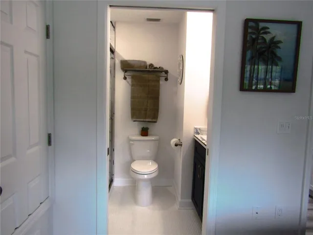 a bathroom with a toilet and a sink